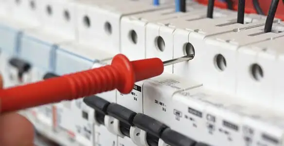 Electrical contractor testing circuit breakers during electrical repair in San Gabriel, CA