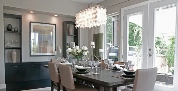 Elegant dining room chandelier installation above table in Pasadena, CA