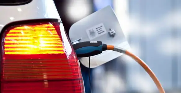Electric car plugged into EV charger after professional installation in Pasadena, CA