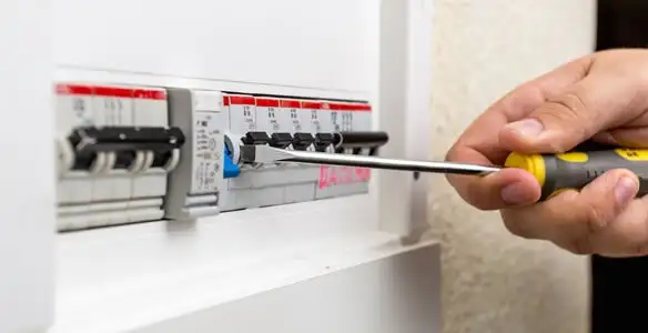 electrical panel upgrade service showing technician adjusting circuit breakers during system upgrade in Pasadena, CA