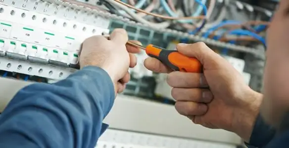electrical service showing licensed electrician performing electrical panel maintenance and adjustments in Pasadena, CA