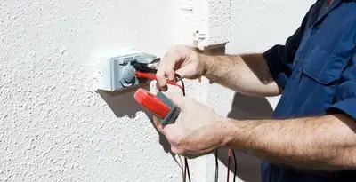 Electrician performing home electrical outlet and wiring inspection in Pasadena, CA