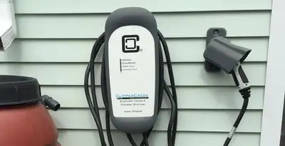 Outdoor electric vehicle charger installation on residential wall in Pasadena, CA