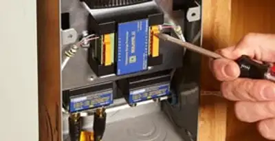 Whole home surge protection device being installed by a licensed electrician to protect electrical systems in Pasadena, CA